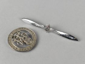 A Silver 'Services Rendered' Brooch, B114517 WWI 1916-1922 and a Chromed RAF Propellor Brooch by W.