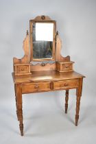 A Stained Pine Dressing Table with Two Drawers, Two Raised Jewel Drawers and Swing Mirror, 88cms