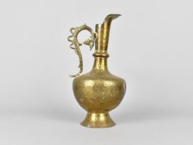 An Indian Brass Jug with Finely Engraved Foliate Decoration. 22cms High