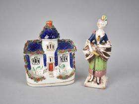 A 19th Century Staffordshire Cottage together with a Continental Figure of a Well To Do Lady