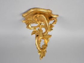 A Continental Gilt Wall Sconce, in the Florentine Style, 52cms Wide and 26cms High