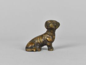 A Miniature Bronze Study of a Seated Dachshund, 4cms Wide
