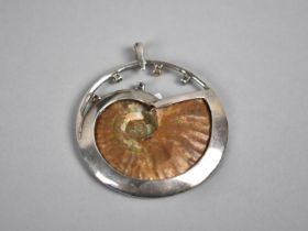 A Nice Quality White Metal Circular Jewelled Pendant, Central Ammonite in White Metal Frame With
