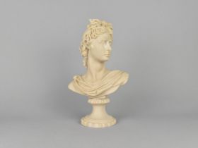 A Cast Resin Bust of a Classical Maiden in the Parian Style, 31cms High