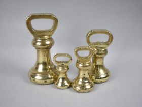 A Graduated Set of Four Edwardian Stamped Brass Bell Weights, 7Lb Example 18cms High