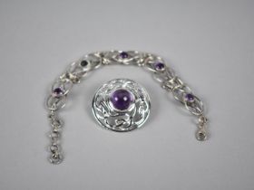 A Silver and Amethyst Bracelet, Wirework Panels in the Form of Knots, Missing One Central Cabochon