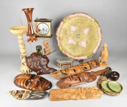 A Collection of Sundries to Include Souvenir Facemasks, Mantle Clock, Wooden Tray