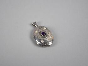 A Modern Silver Locket with Central Oval Mixed Cut Amethyst and Four Radiating Pearl Embellishments,