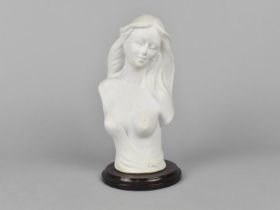 A Capodimonte Parian Style Figure of Topless Girl on Circular Wooden Plinth, 20cms High