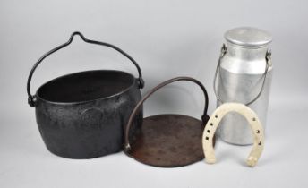 An Aluminium Cylindrical Milk Churn, an Oval Iron Cooking Pan and a Heavy Horse Shoe