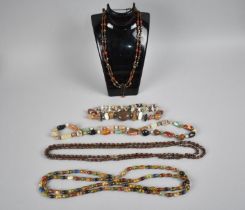 A Collection of Various Glass and Stone Bead Necklaces