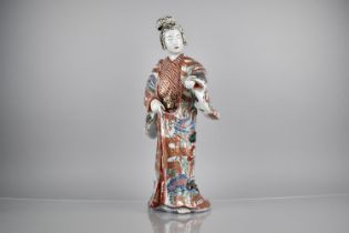 A Japanese Meiji Period Porcelain Study of a Geisha, Decorated in Imari Palette with Gilt