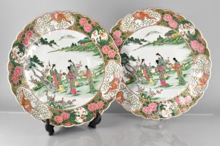 Two Large Oriental Porcelain Chargers with Scalloped Edge Decorated with Central Exterior Scenes