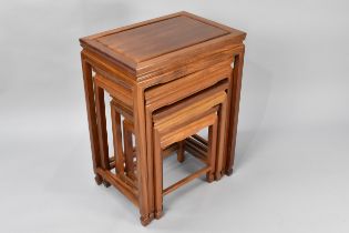 A Nest of Four Chinese Hardwood Tables, the Largest 50x35x66cm high