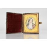 A 19th Century Portrait of a Maiden Painted on Ivory in a Leather Folding Travelling Case, Miniature