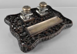 A Chinese Late Qing Dynasty Hardwood and Silver Inkstand, the Shaped Base Carved and Pierced with