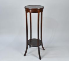 An Edwardian Mahogany Two Tier Circular Topped Jardiniere Stand, 34cms Diameter and 99cm High