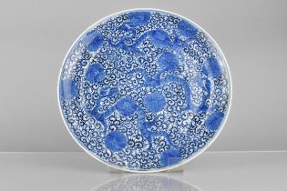 A Chinese Qing Dynasty Porcelain Blue and White Plate Decorated with Three Dragons Amongst