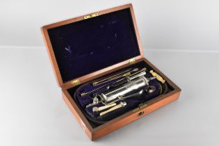A Late Victorian/Edwardian Mahogany Cased Dosing Syringe by Ferris and Co., 32x19x7cm