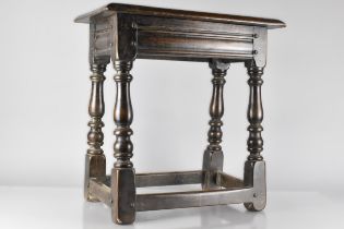 An 18th/19th Century Oak Jointed Stool with Moulded Single Plank Top over Turned Legs United by