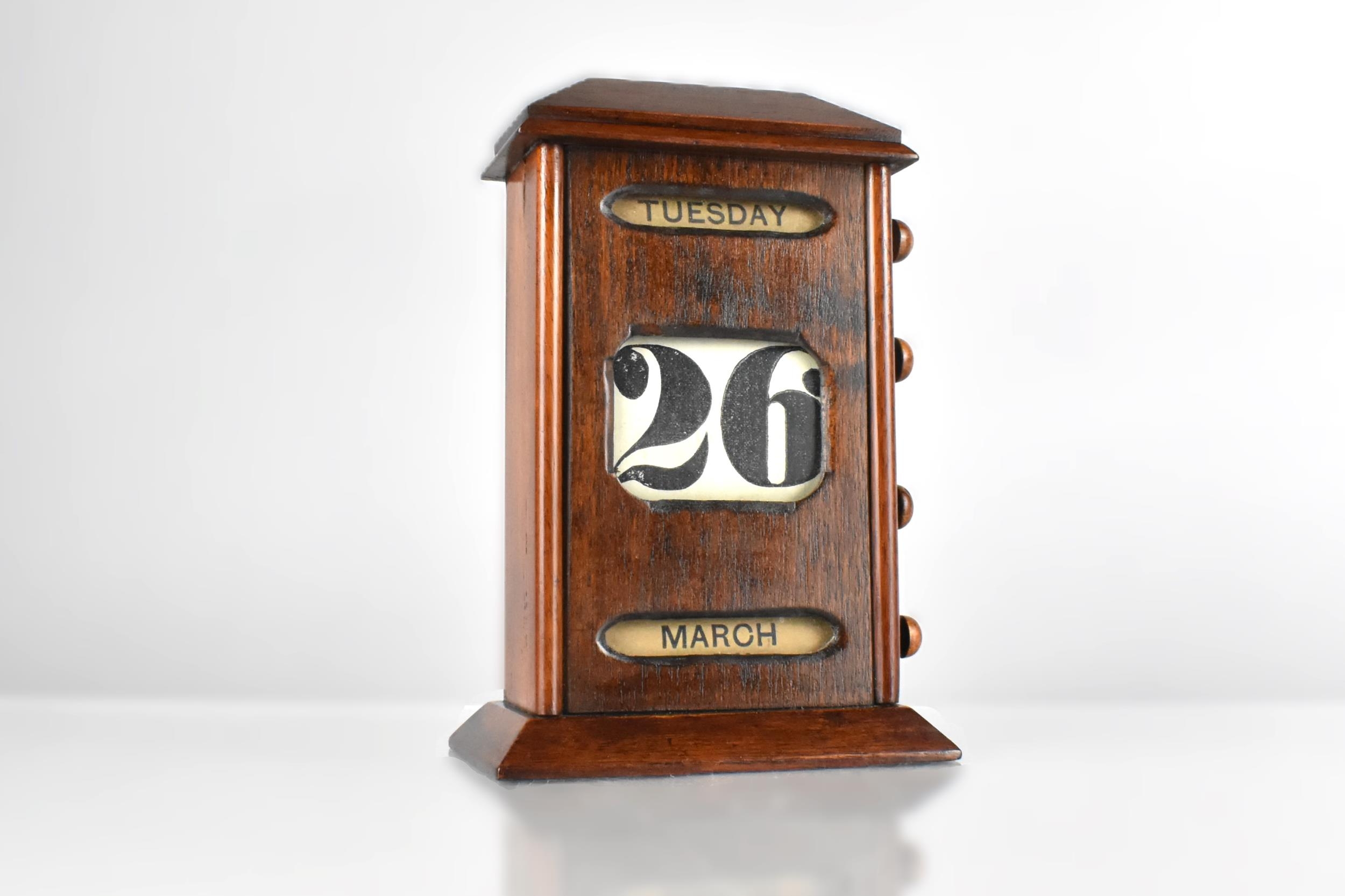 An Edwardian Oak Desktop Perpetual Calendar with Day, Date and Month, 21cm High