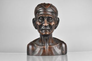 An Early 20th Century Balinese Carved Hardwood Bust of an Elderly Man Wearing a Traditional