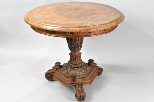 A 19th Century Walnut Topped Centre Table, the Circular Top on Carved Bulbous Support Culminating to