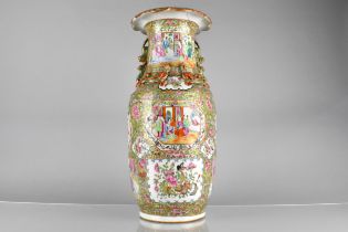 A Chinese Qing Dynasty Porcelain Famille Rose Vase Decorated in the Usual Manor with Figural Court