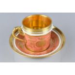 An 18th/19th Century Continental Porcelain Cup and Saucer Decorated in Gilt with Neo Classical Swags