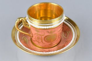 An 18th/19th Century Continental Porcelain Cup and Saucer Decorated in Gilt with Neo Classical Swags
