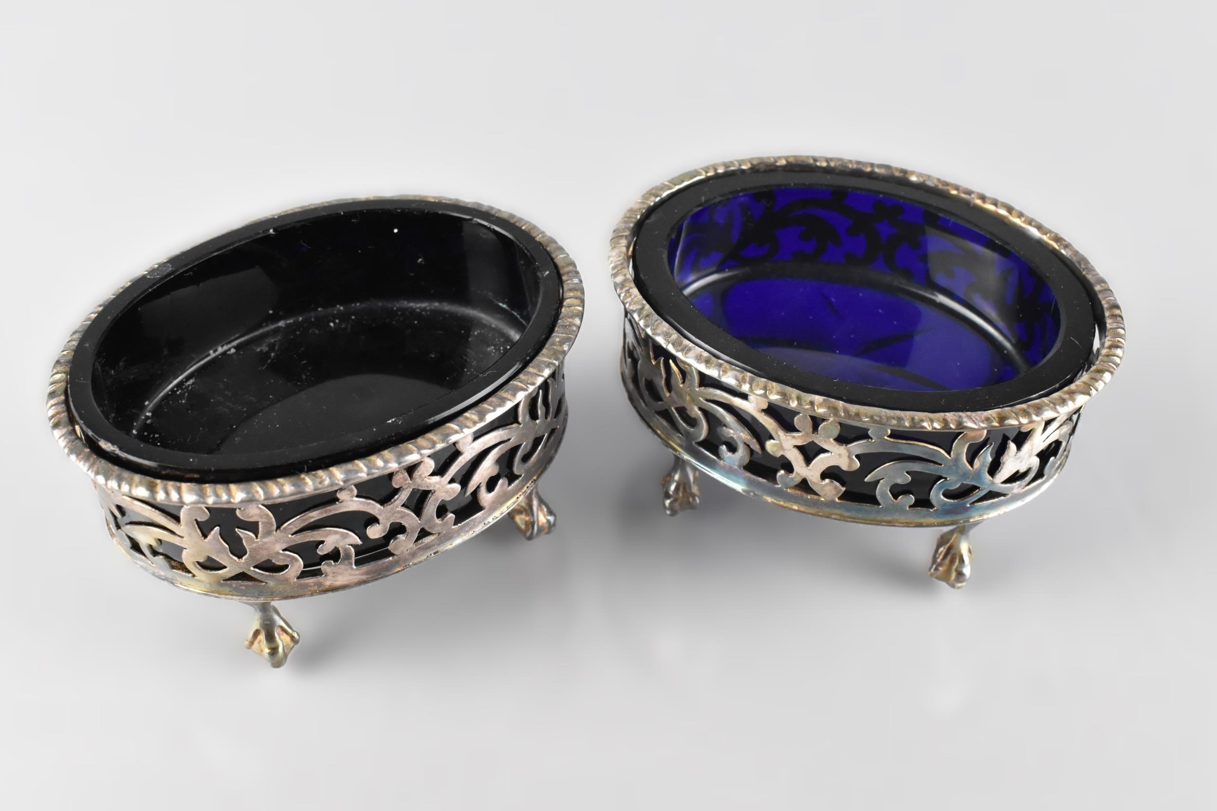 A Pair of Edward VII Silver Salts with Pierced Scrolled Sides Raised on Claw and Ball Feet, Complete