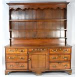 A Good George III Cheshire Dresser in Oak with Mahogany Cross Banding to Top and Drawers. On Bracket