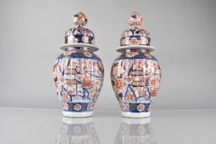 A Pair of Japanese Edo Period Imari Baluster Vase and Covers 33cm High, Restoration to One Cover