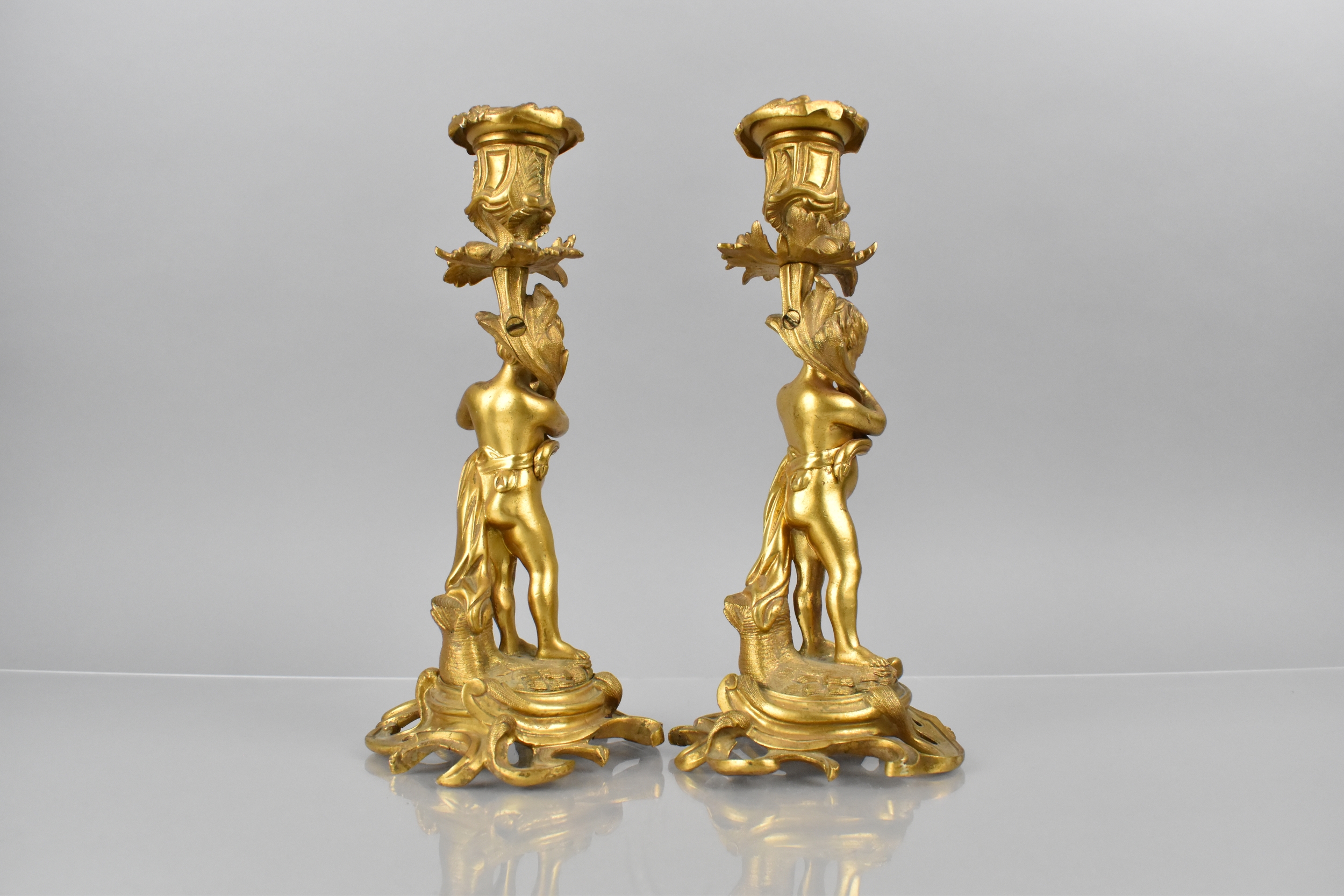 A Pair of 19th Century Gilt Bronze Candlesticks Modelled with Classical Cherubs Supporting - Image 3 of 4