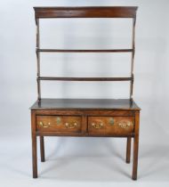 A 19th Century Oak Two Drawer Dresser of Small Proportions With Two Shelf Open Plate Rack, Brass