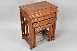 A Nest of Four Chinese Hardwood Tables, the Largest 50x35x66cm high