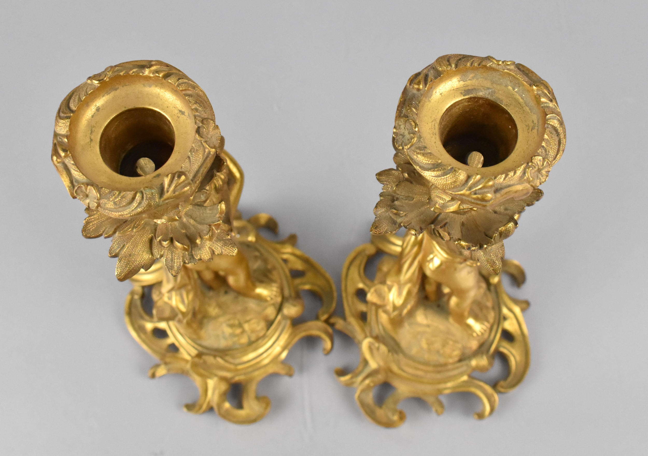 A Pair of 19th Century Gilt Bronze Candlesticks Modelled with Classical Cherubs Supporting - Image 4 of 4