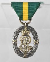 A King Edward VII Territorial Silver Decoration Medal Garrard & Co Ltd with Green and yellow Band