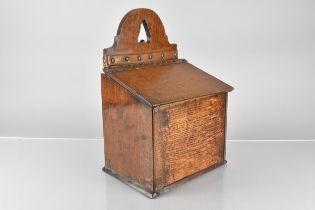 A 19th Century Oak Salt Box with Pierced Heart Pediment and Sloping Hinged Cover 34cm High, 16.5cm