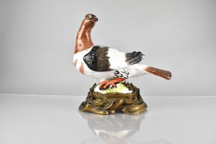 A 19th Century Gilt Bronze Mounted Porcelain Model of a Bird on Oval Acanthus Cast Rocaille Gilt