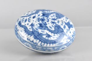 A Chinese Porcelain Blue and White Circular Box and Cover Decorated with Dragons and Flaming