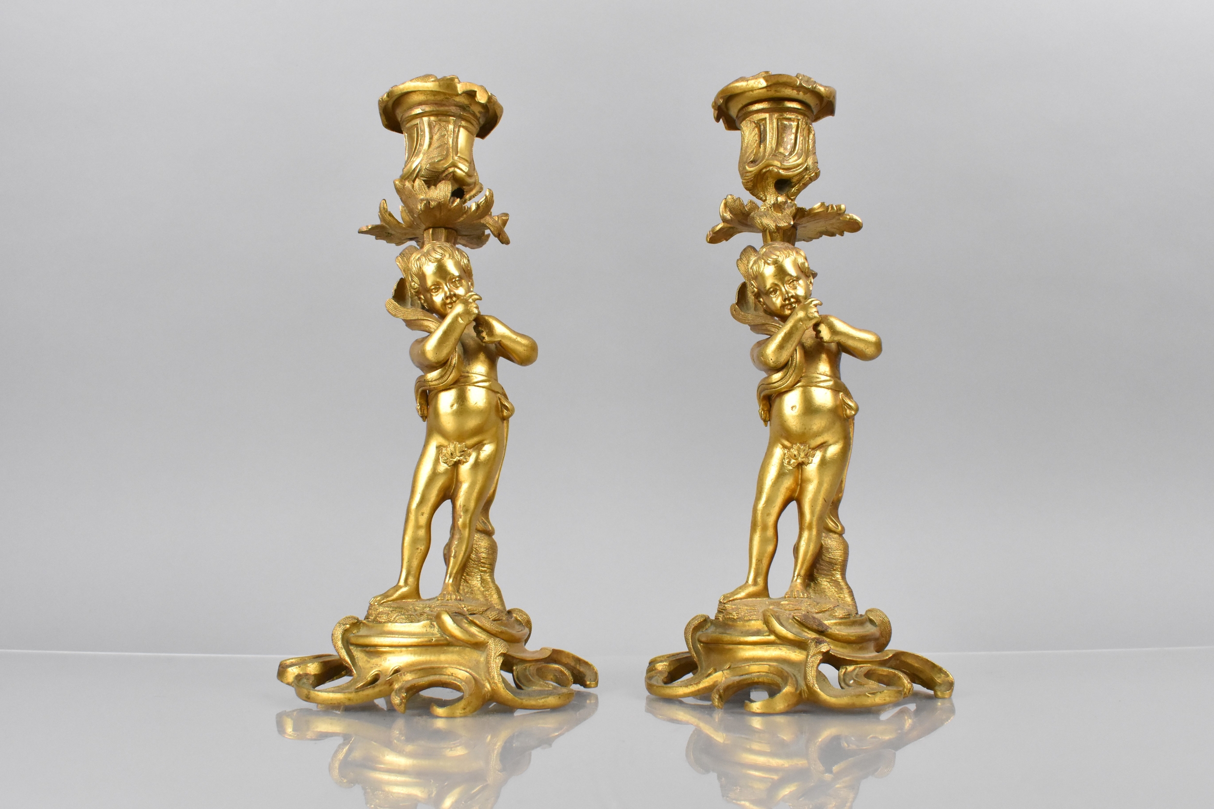 A Pair of 19th Century Gilt Bronze Candlesticks Modelled with Classical Cherubs Supporting - Image 2 of 4