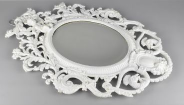 A Late Victorian Mirror with Ornate Cast Iron Frame Incorporating Cherub and Peacock Design,