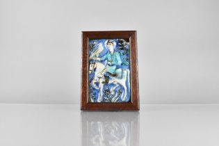 A Framed Persian Qajar Dynasty (18th/19th Century) Polychrome Glazed Pottery Tile Depicting