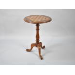 A Circular Tripod Games Table with Chess Board Top in Rosewood, Maple and Mahogany, 48cms Diameter