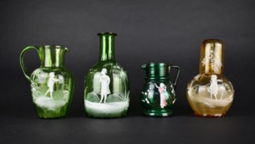 Four Pieces of "Mary Gregory" Glass to Comprise Green Glass Jugs, Bottle Decanter and an Amber Glass