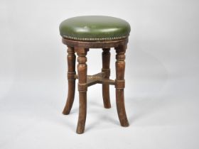 A Vintage Circular Leather Seated Four Legged Stool, 32cms Diameter and 51cms High