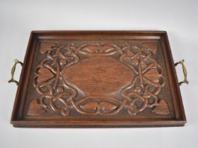 A Late Art Nouveau/Early Arts and Crafts Carved Wooden Rectangular Tray with Two Brass Handles,