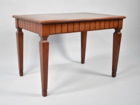 A Modern Mahogany Rectangular Coffee Table with Crossbanded Top and Tapering Square Supports,