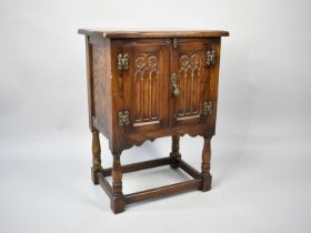 A Mid 20th Century Oak Side Cabinet in the Old Charm Style with Panelled Doors, 52cms Wide and 68cms